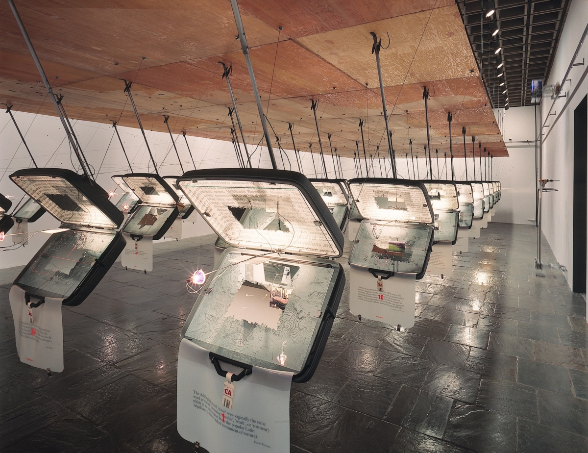 Tourisms: suitCase Studies — Suitcases equipped with maps, postcards, explanatory texts, and bar-coded destination tags